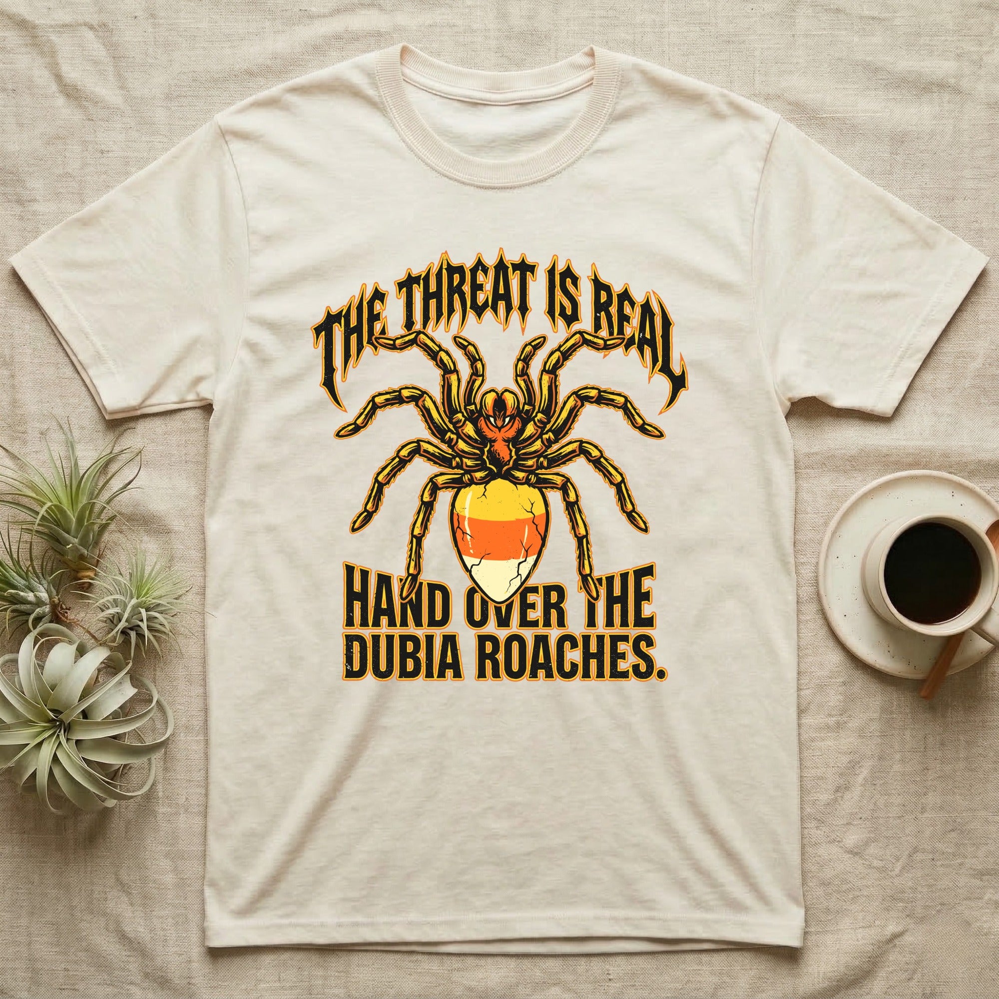 Tarantula Threat Dubia Roaches T-Shirt in Natural — Metal-style tarantula in threat posture with a candy-corn abdomen, "The Threat Is Real, Hand Over the Dubia Roaches."