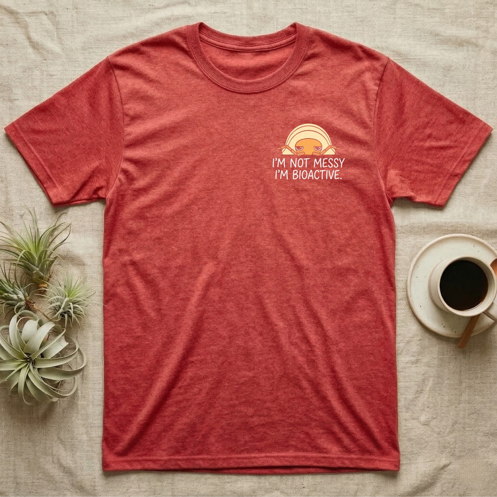 Bioactive Rubber Ducky T-Shirt in Heather Red — Creamy-yellow rubber ducky isopod with an orange face peeking over white marker capitals reading I'M NOT MESSY I'M BIOACTIVE.