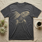 Box Turtle Portrait T-Shirt in Dark Heather — Single-ink eastern box turtle portrait in near-profile, lit hard from one side and dissolving into black.