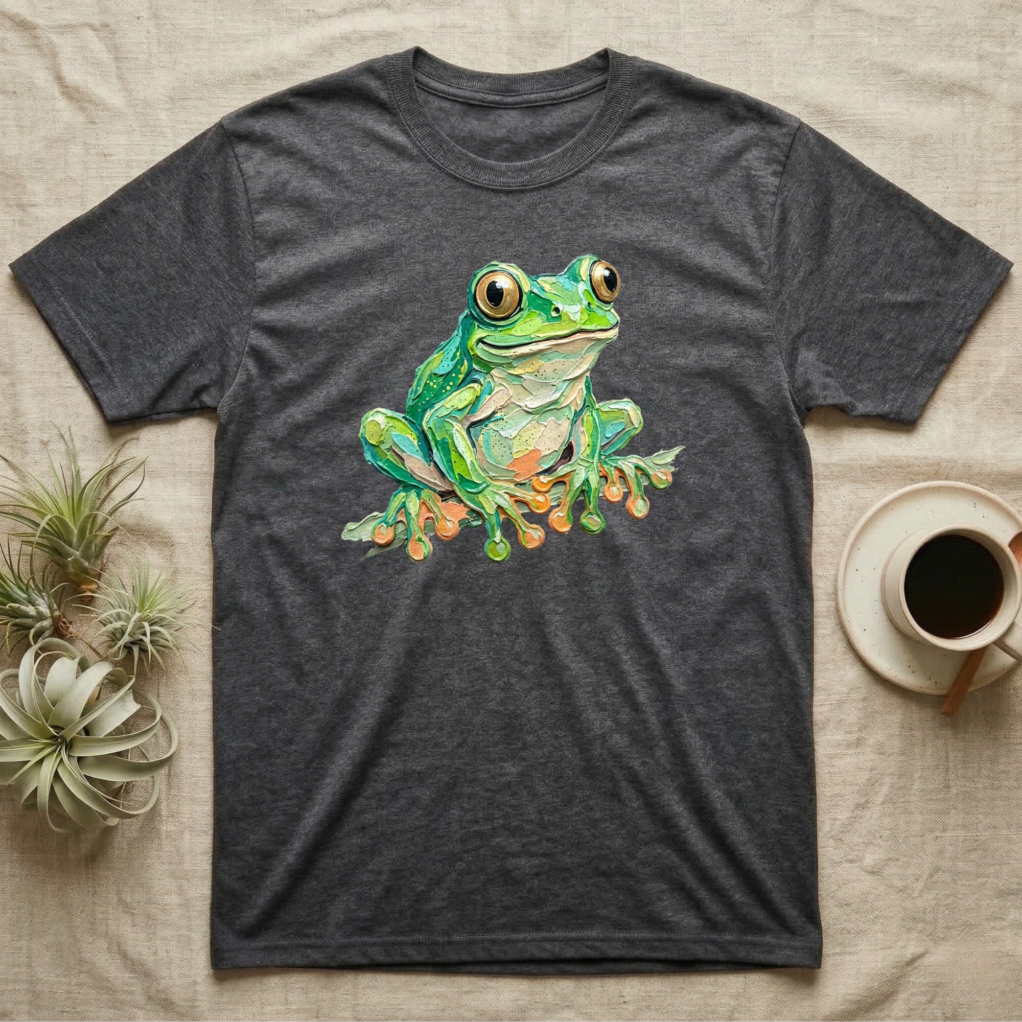 Dark gray t-shirt with a vibrant green frog illustration.