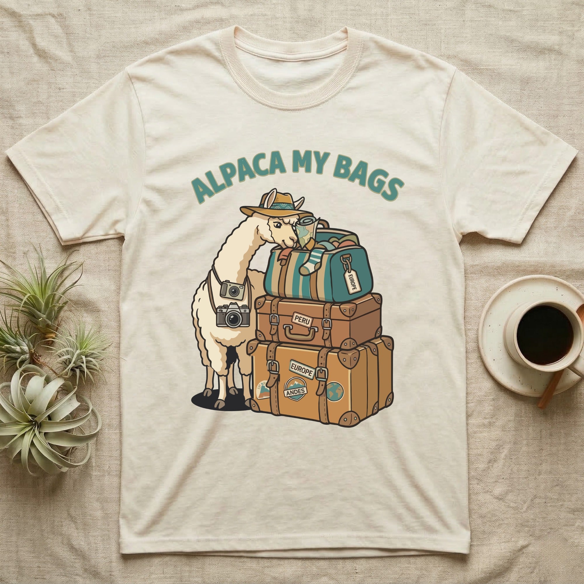 Alpaca wearing a hat, carrying luggage and cameras. Text: Alpaca My Bags.