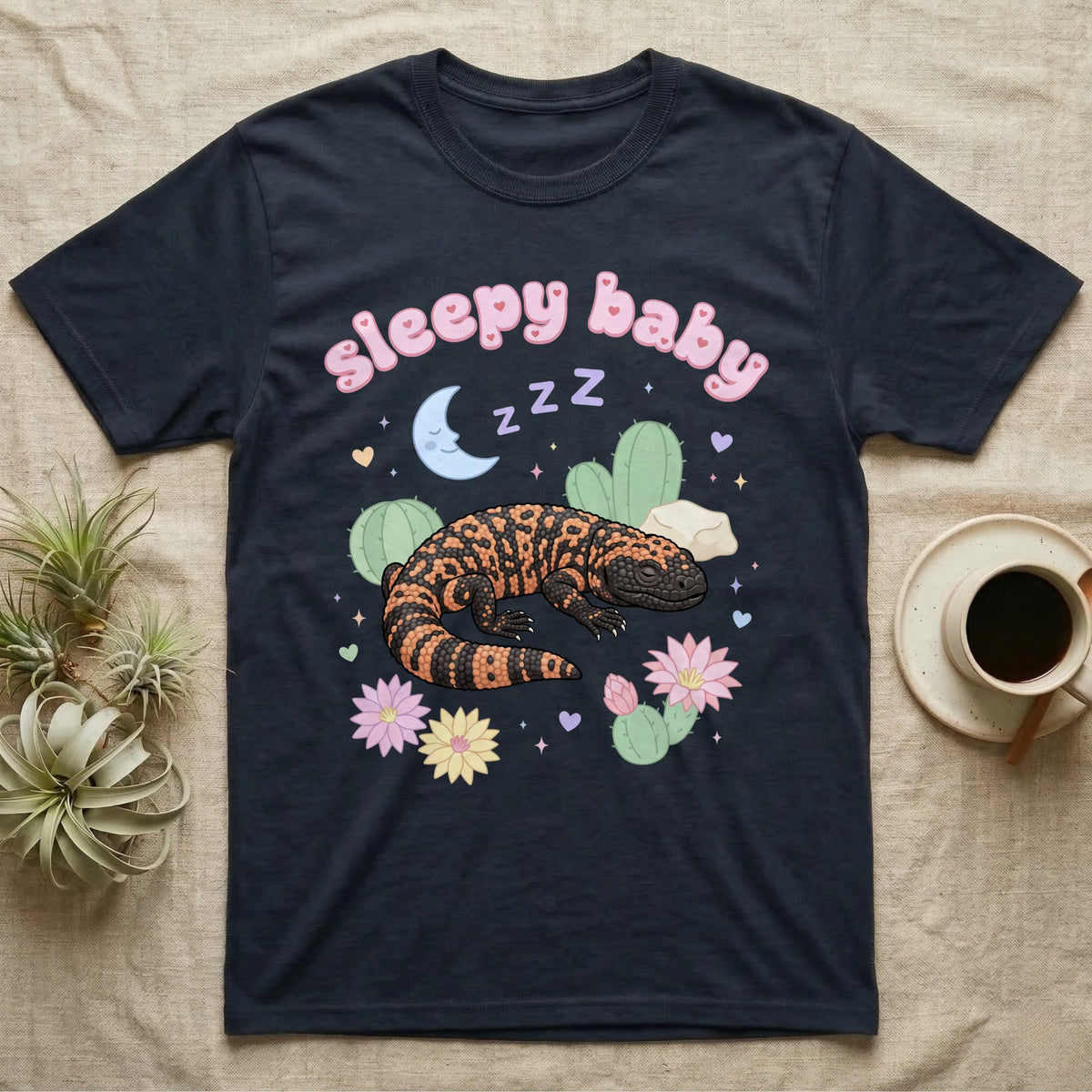 Gila Monster Baby T-Shirt in Navy — Pastel Gila monster with sleepy eyes, crescent moon and Z Z Z, puffy salmon bubble wordmark "sleepy baby" above.