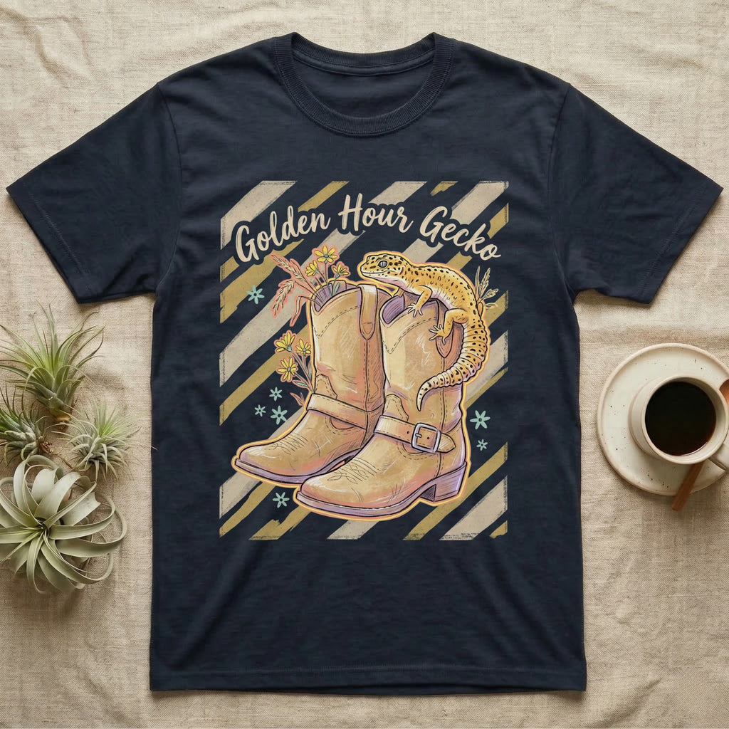 Dark t-shirt with cowboy boots, gecko, and "Golden Hour Gecko" text.