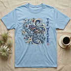 Light blue t-shirt with a jumping spider and floral design.