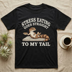 Fat-Tailed Gecko Snacking T-Shirt in Black — Engraved fat-tailed gecko lounging on a stone with mealworms under Stress Eating Goes Straight To My Tail