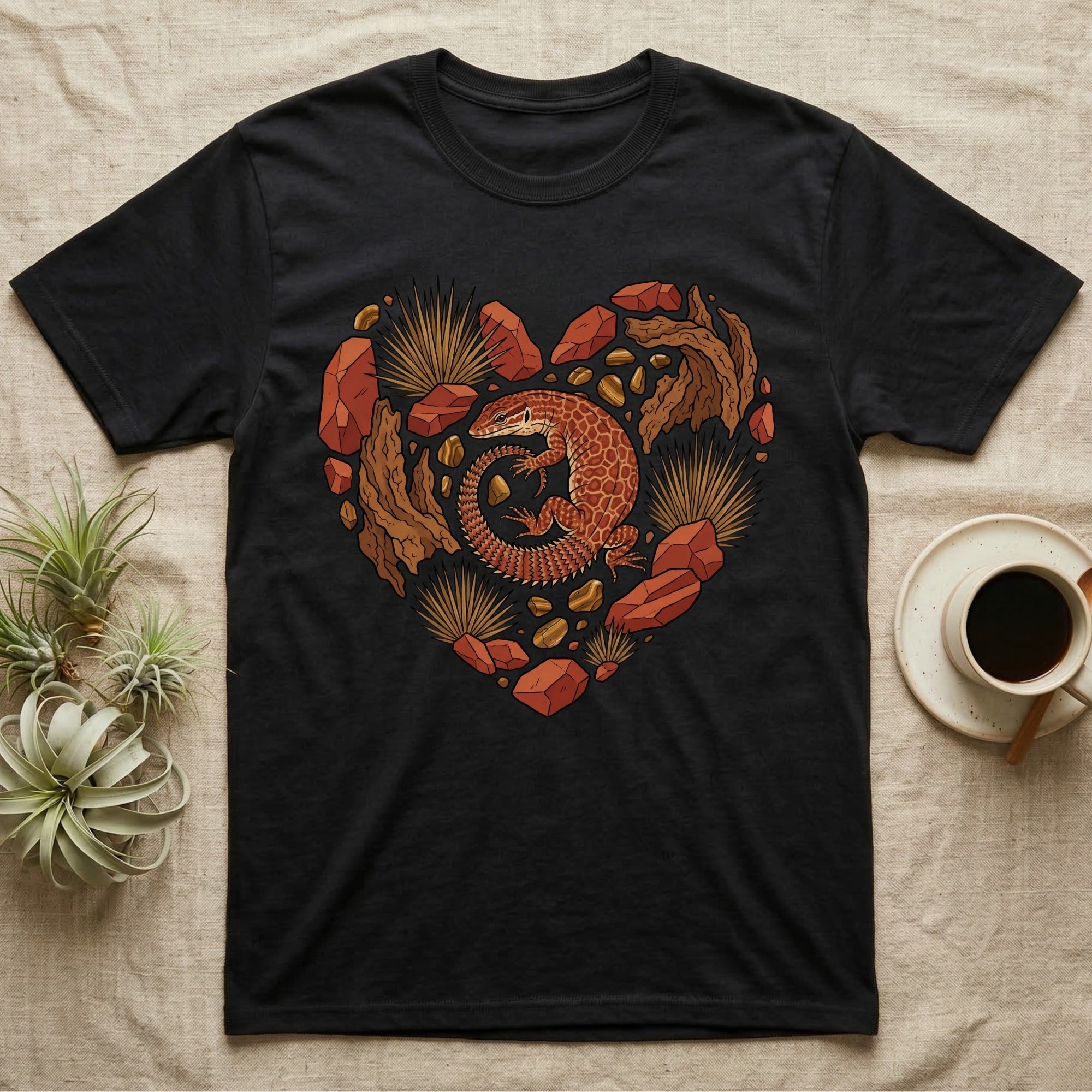 Black t-shirt with a heart-shaped graphic featuring a lizard and desert rocks.