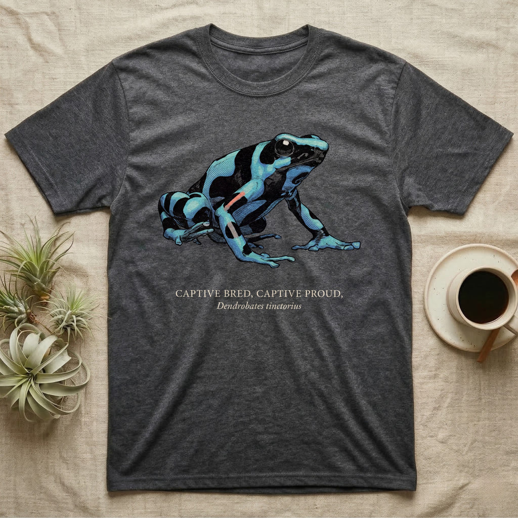 Captive Bred Frog T-Shirt in Dark Heather — Naturalist-plate illustration of a healthy dyeing dart frog above a serif creed reading Captive Bred Captive Proud.
