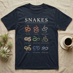 Snake Species Chart T-Shirt in Navy — Watercolour chart of nine named North American snakes under a cream serif Snakes title on charcoal grey