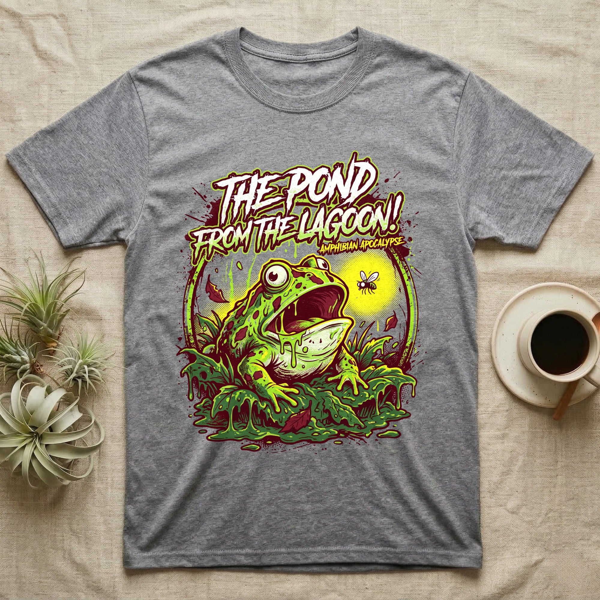 Pacman Frog Lagoon Apocalypse T-Shirt in Sport Grey — B-movie horror poster of a Pacman frog bursting from slime at a fly, "The Pond From the Lagoon, Amphibian Apocalypse."