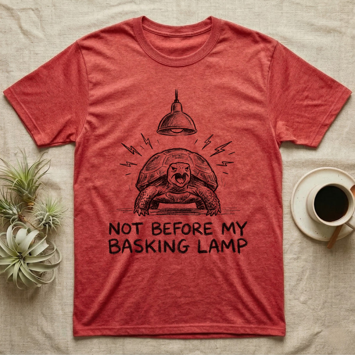 Russian Tortoise Mornings T-Shirt in Heather Red — Charcoal drawing of a grumpy Russian tortoise yelling up at a basking lamp above the words NOT BEFORE MY BASKING LAMP.