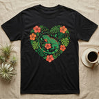 Black t-shirt featuring a green iguana surrounded by tropical leaves and red hibiscus flowers.