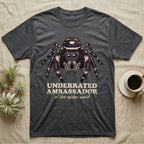 Underrated Ambassador Spider T-Shirt in Dark Heather — Soft creepy-cute portrait of a big-eyed jumping spider with hand-lettered text reading Underrated Ambassador of the Spider World.