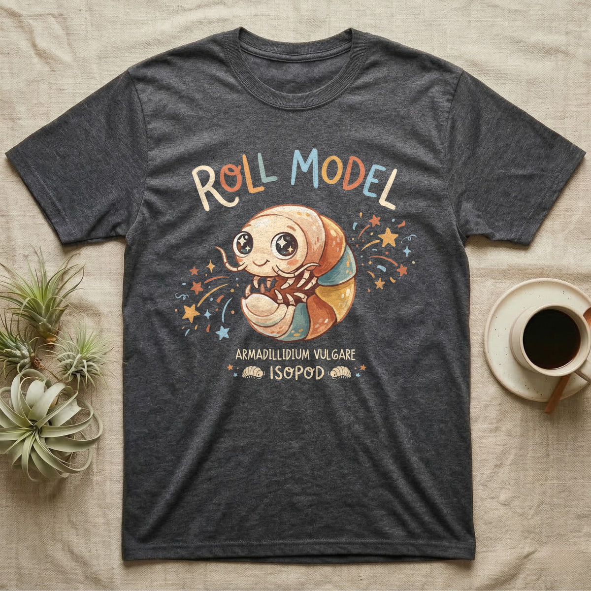 Roly Poly Isopod Roll Model T-Shirt in Dark Heather — Storybook roly poly curled into a roll with starry eyes and confetti under hand-lettered "Roll Model".