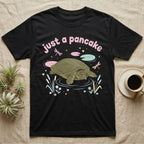 Spiny Softshell Turtle Baby T-Shirt in Black — Pastel spiny softshell turtle with flat shell and snorkel nose among lily pads, puffy pink wordmark "just a pancake" above.