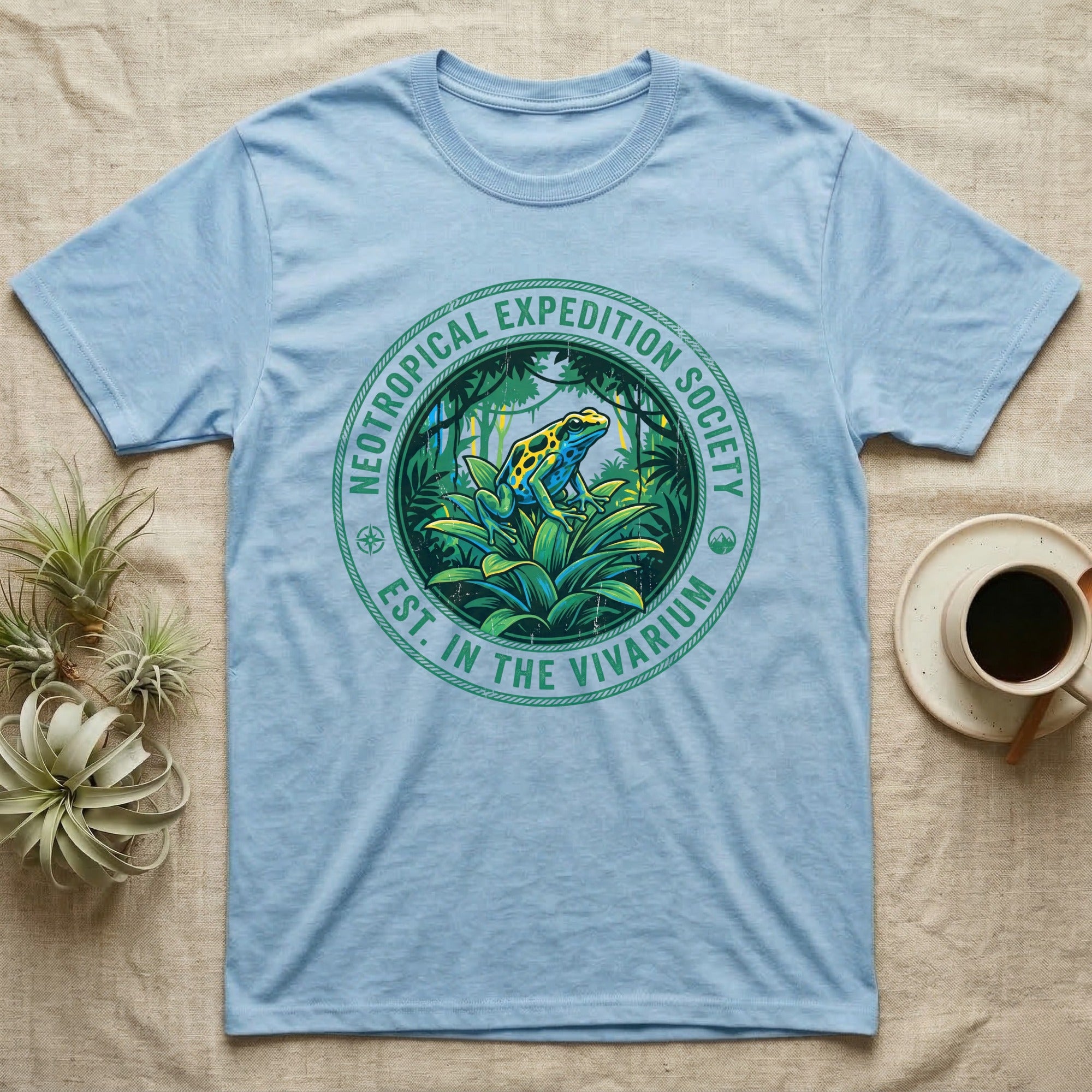 Light blue t-shirt with Neotropical Expedition Society frog design.