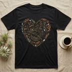 Black t-shirt with heart-shaped design of a gecko surrounded by leaves and mushrooms.