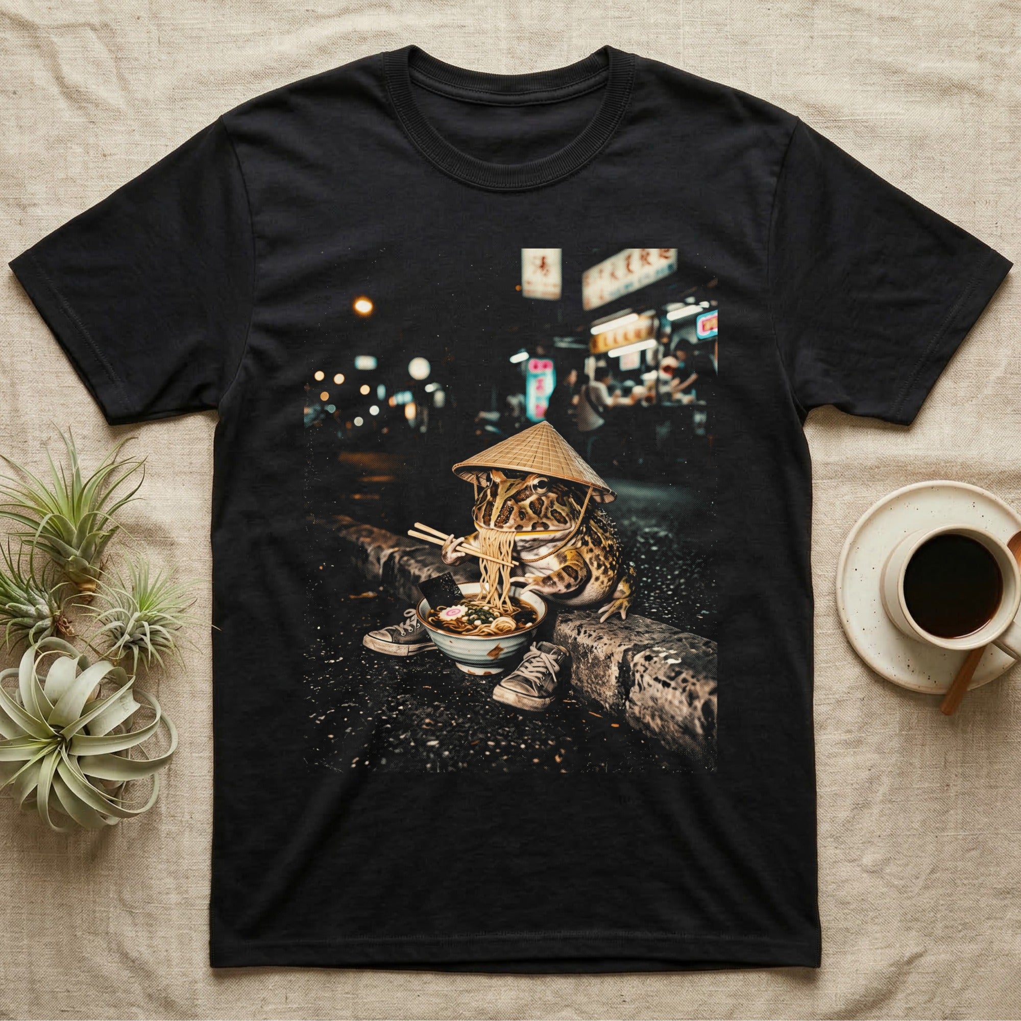 Frog wearing a conical hat eats ramen with chopsticks by a city street at night.