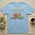 Light blue t-shirt with a cartoon snail on a branch, saying "I'll get there... eventually."