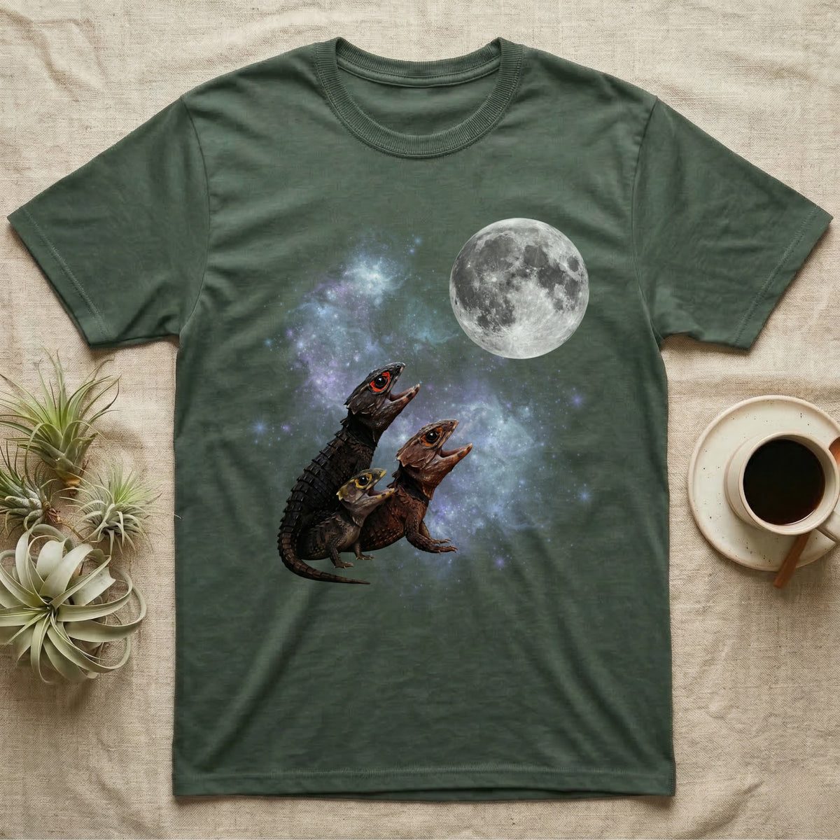 Red-Eyed Crocodile Skink Moon Howl T-Shirt in Military Green — Three Red-Eyed Crocodile Skink colour morphs howling at a full moon over a nebula on a dark grey t-shirt.