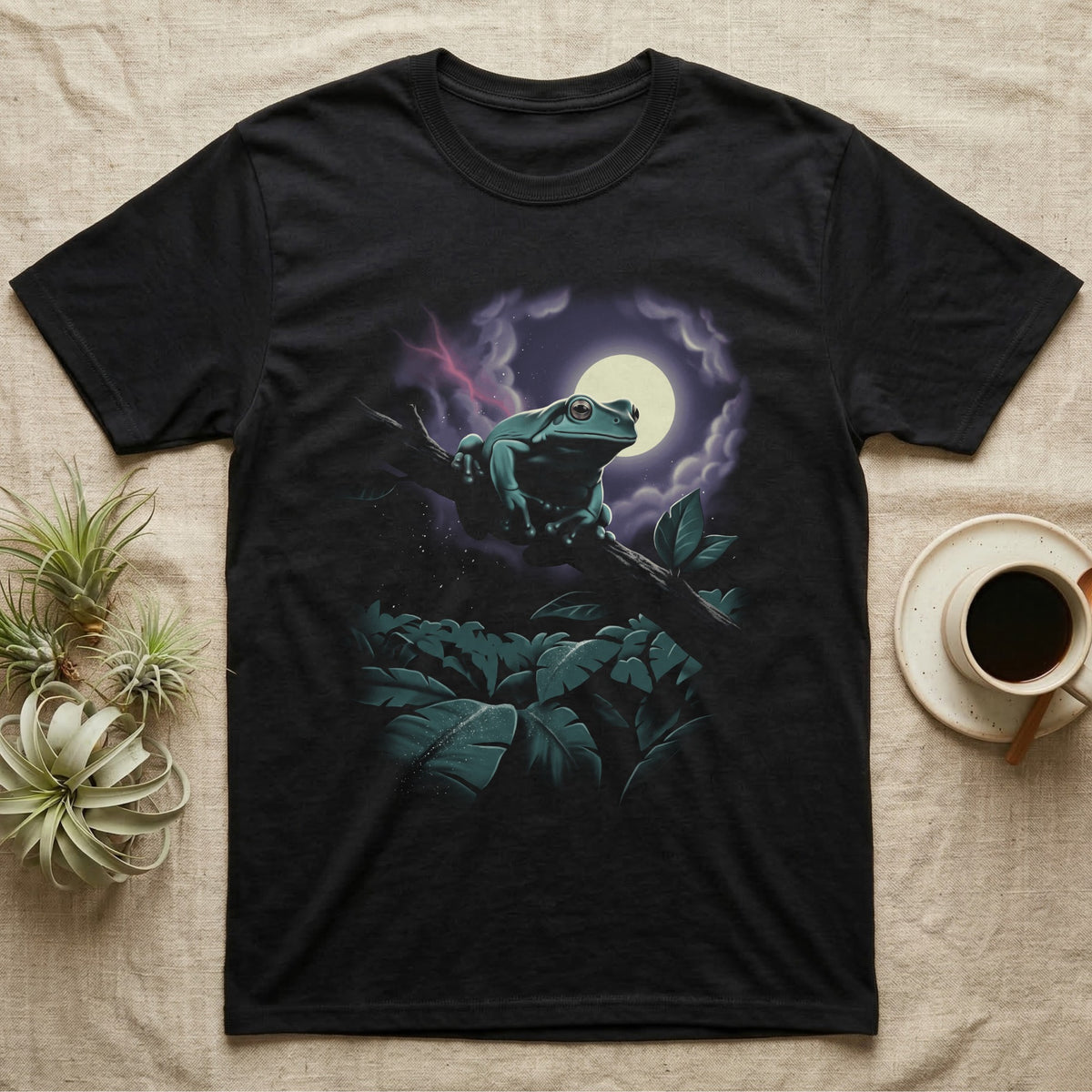 White's Tree Frog Moonlit T-Shirt in Black — Airbrushed night scene of a White's tree frog leaping up through moonlit canopy leaves toward a full moon.