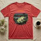 Glass Frog See-Through T-Shirt in Heather Red — Flat-colour circle-window illustration of a glass frog silhouetted crossing a rainforest canopy scene.
