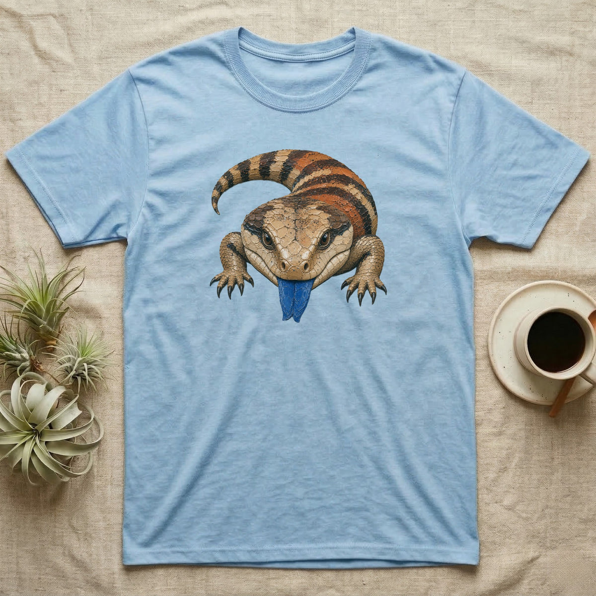 Light blue t-shirt with a blue-tongued skink graphic.