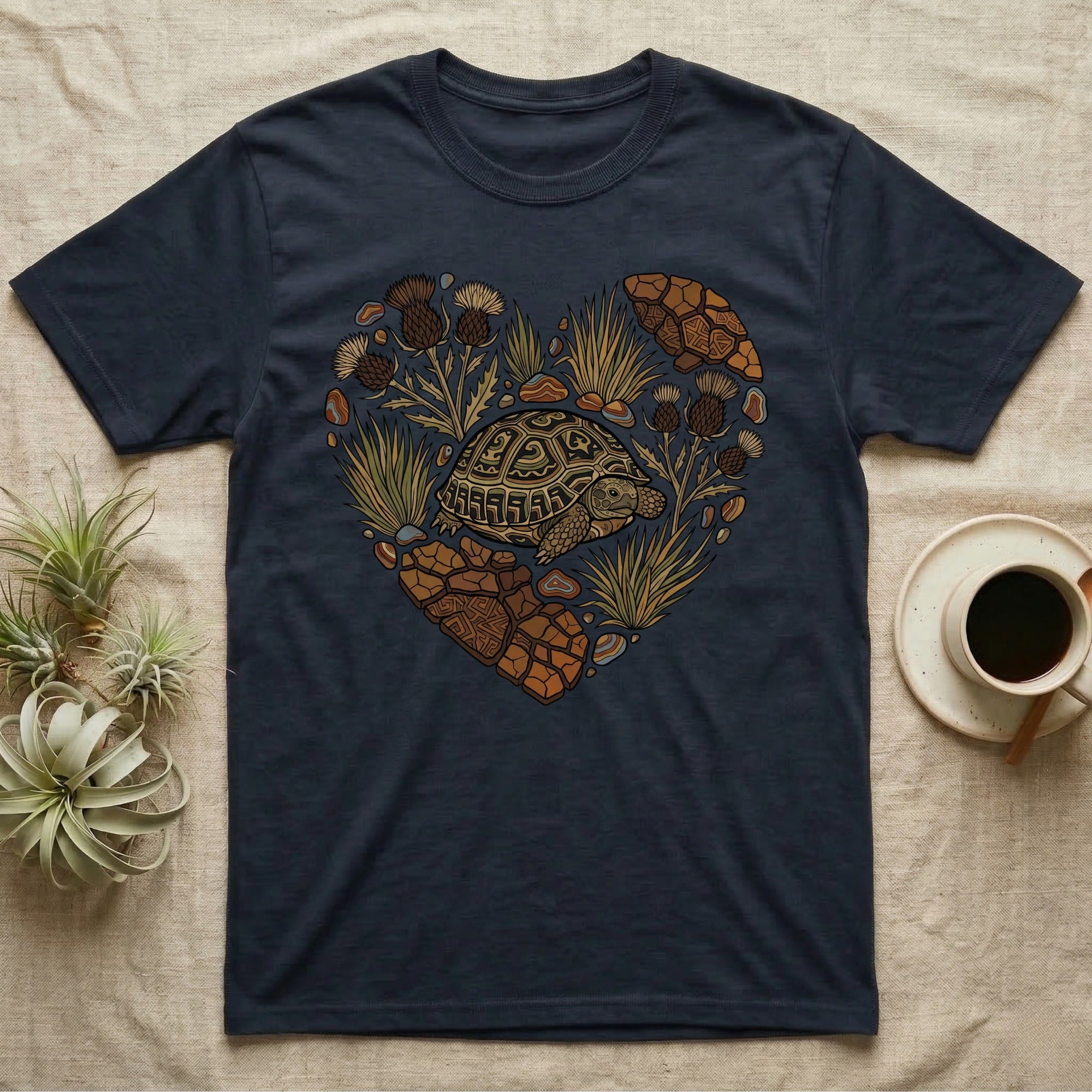Dark blue t-shirt with heart-shaped turtle and desert plant graphic.