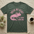 Axolotl Regrow T-Shirt in Military Green — Worn one-ink pink axolotl walking side-on, gills spread, under Break My Heart, I'll Grow a New One