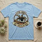 Tarantula Don't Touch Enclosure Tee in Light Blue — Distressed circular badge of a defensive tarantula on desert ground, red and gold banner reading Don't Touch My Enclosure, on black.