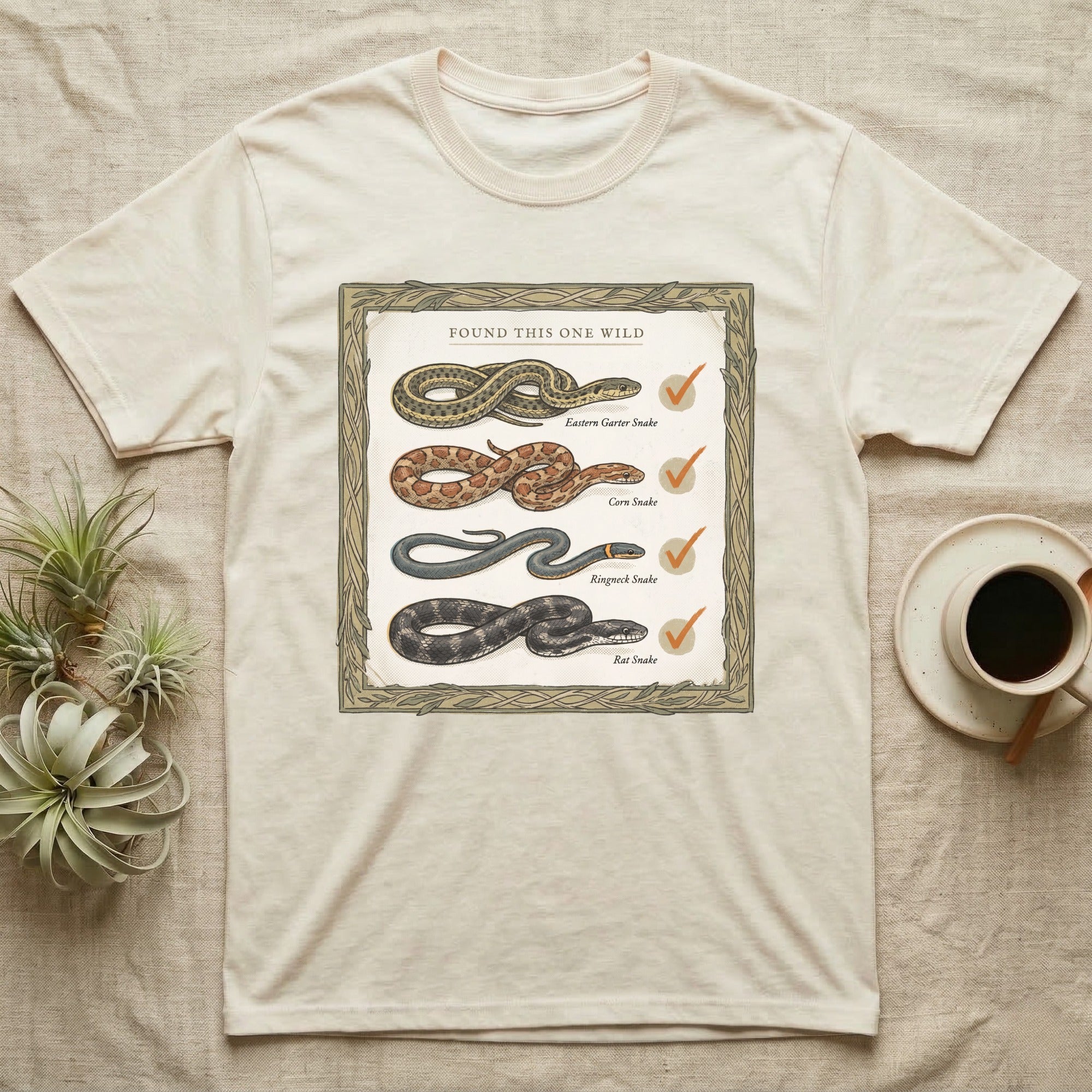 Native Snake Life List T-Shirt in Natural — Vintage field-guide life list of native snakes drawn as small specimens with tally checkmarks beside each.