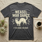 Weasel War Dance Ferret Tee in Dark Heather — Grunge-distressed ferret mid-war-dance in S-curve bounce with stacked type "Weasel War Dance / If You Know."