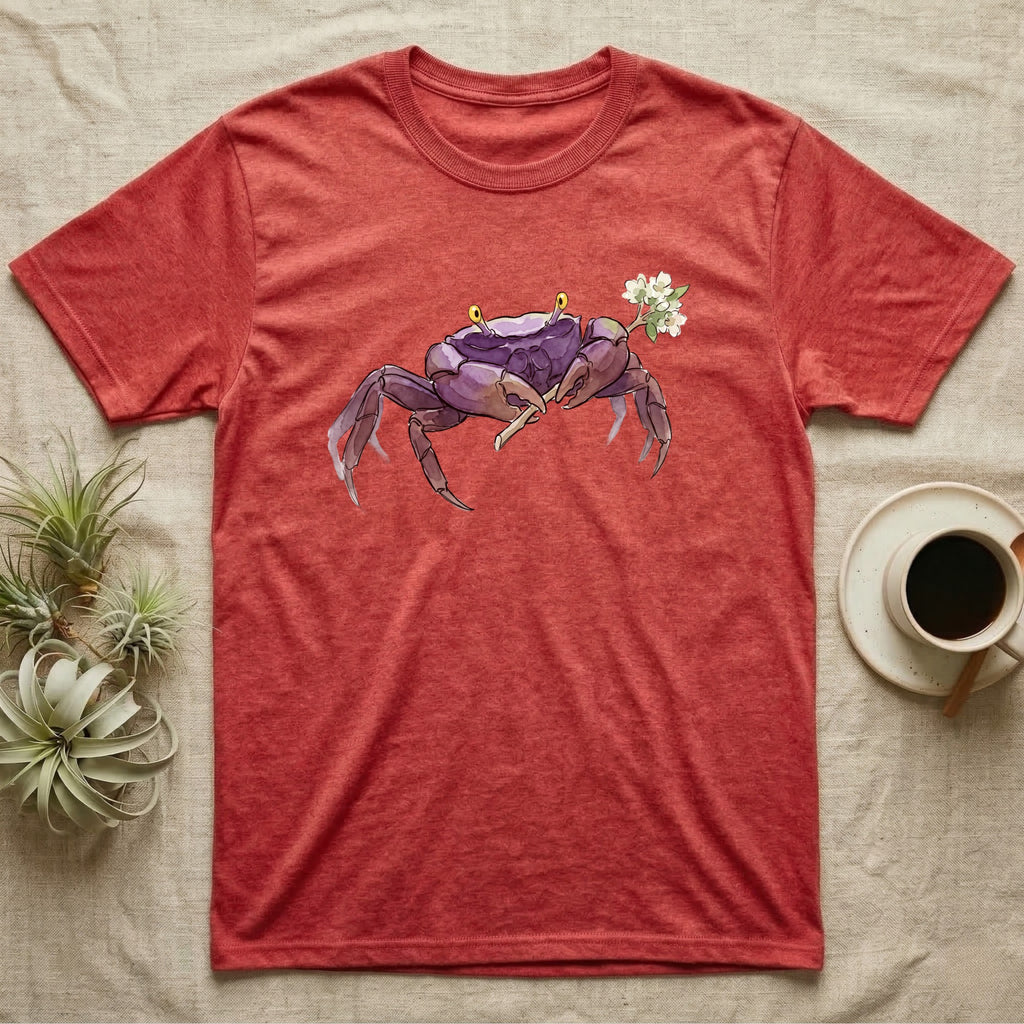 Vampire Crab Blossom T-Shirt in Heather Red — Watercolor illustration of a violet-purple vampire crab with yellow eye stalks holding a moss-flower blossom sprig, on a dark grey t-shirt.