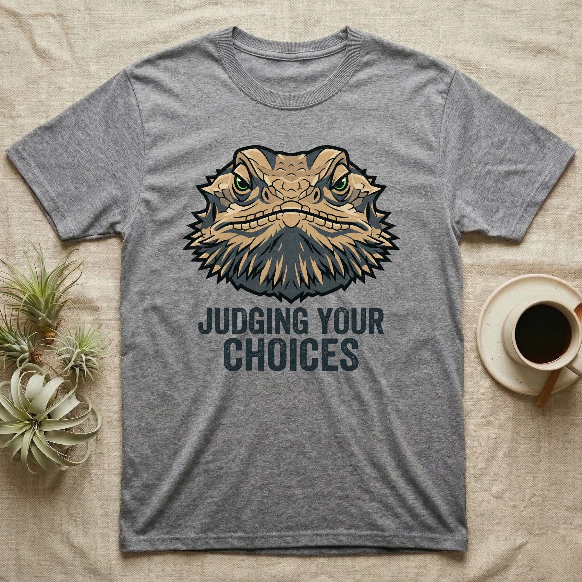 Grey t-shirt with a bearded dragon graphic and text "JUDGING YOUR CHOICES".