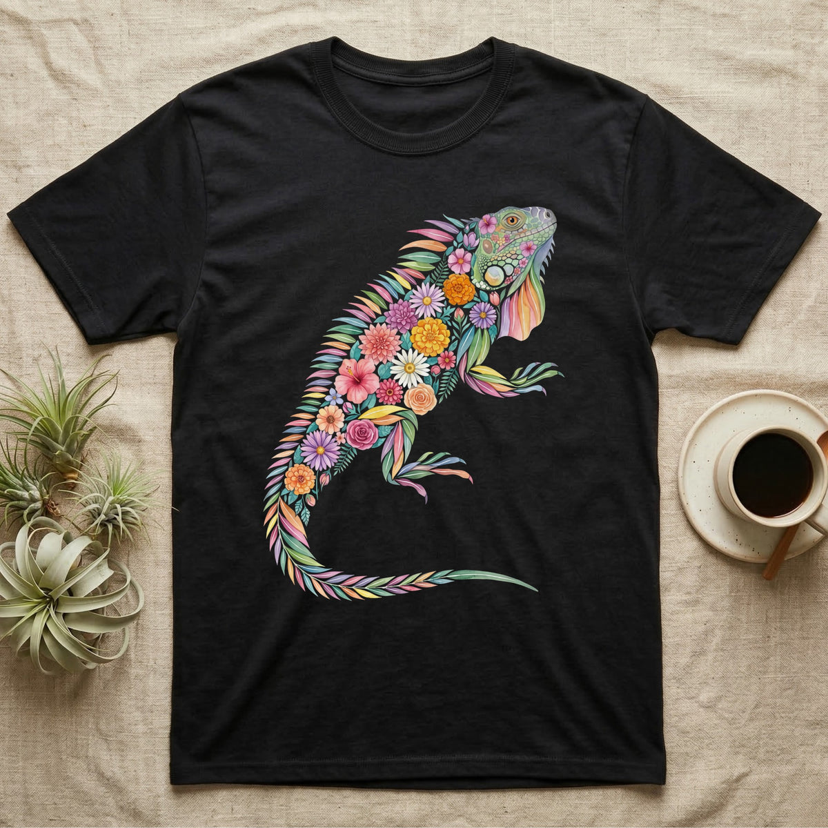 Green Iguana Floral Mosaic T-Shirt in Black — Watercolour green iguana climbing, its whole body built from painted hibiscus, dandelion and leaf shapes.
