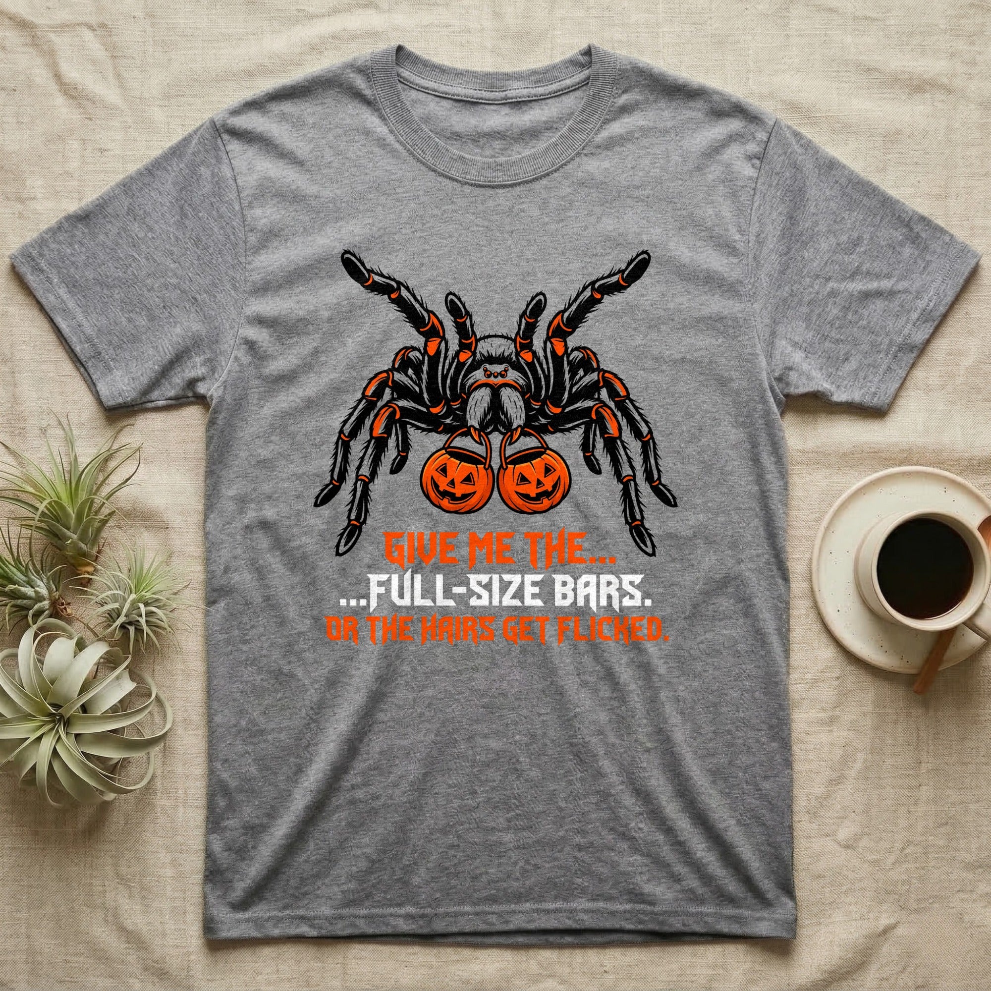 Tarantula Full-Size Bars T-Shirt in Sport Grey — Black-and-orange tarantula holding two jack-o'-lantern buckets, "Give Me the Full-Size Bars Or the Hairs Get Flicked."