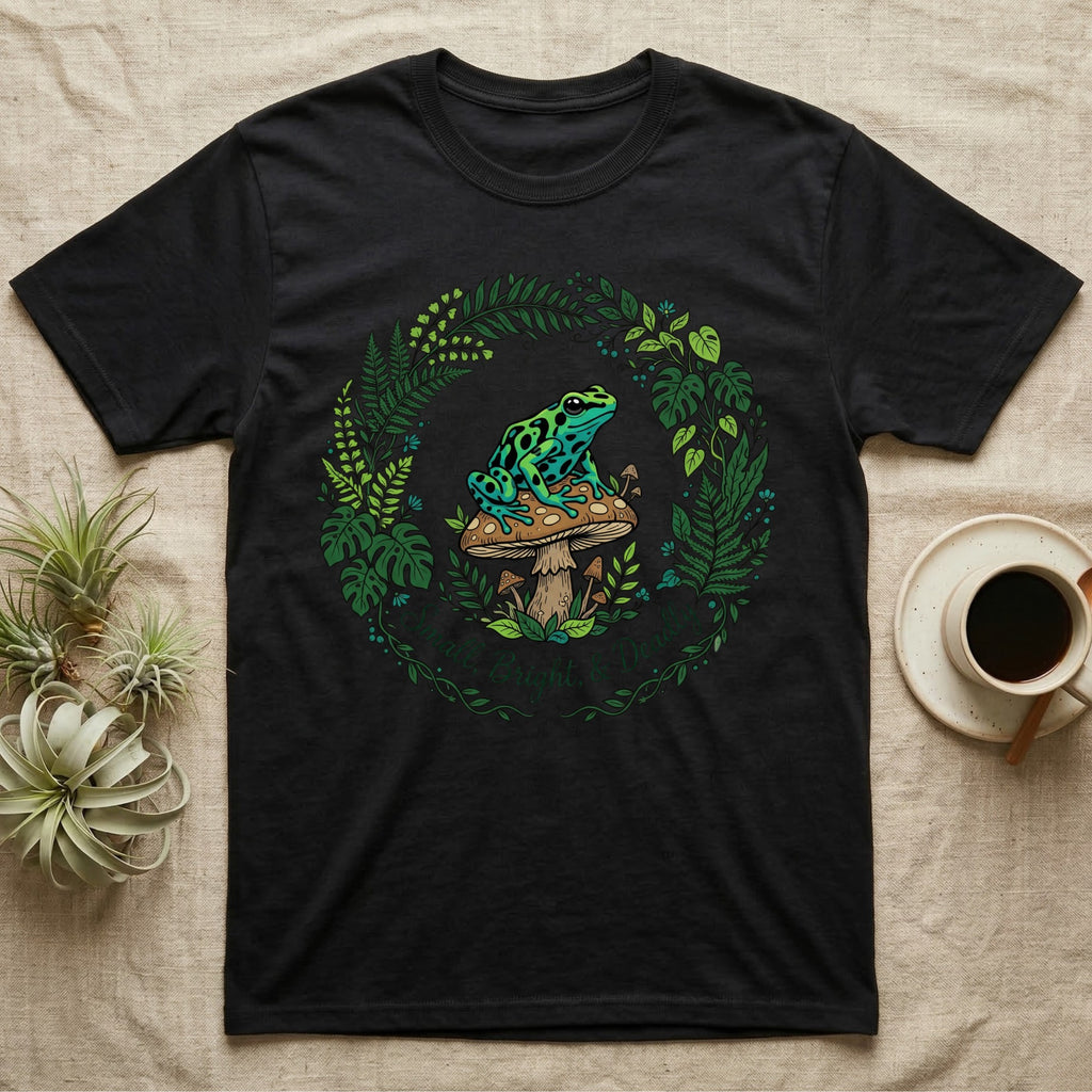 Black t-shirt with a circular floral design featuring a frog on a mushroom.