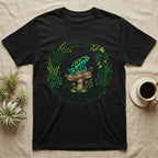 Black t-shirt with a circular floral design featuring a frog on a mushroom.