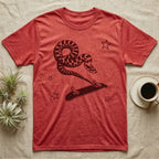 Western Hognose Kickflip T-Shirt in Heather Red — Distressed one-ink oxblood screenprint of a western hognose snake airborne, tail snapped straight into a skateboard caught upside down mid-kickflip.