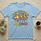 Dairy Cow Isopod Patchwork T-Shirt in Light Blue — Quilt-patchwork dairy cow isopod in mustard and denim under retro "Easily Distracted By Isopods" text.