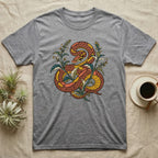 Grey t-shirt with a stylized orange and yellow snake design surrounded by green leaves.