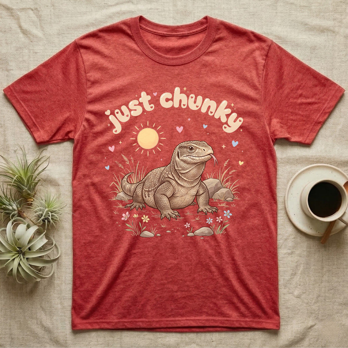 Savannah Monitor Softie T-Shirt in Heather Red — Plump savannah monitor lizard with flicking tongue under pastel bubble text "just chunky" and hearts.
