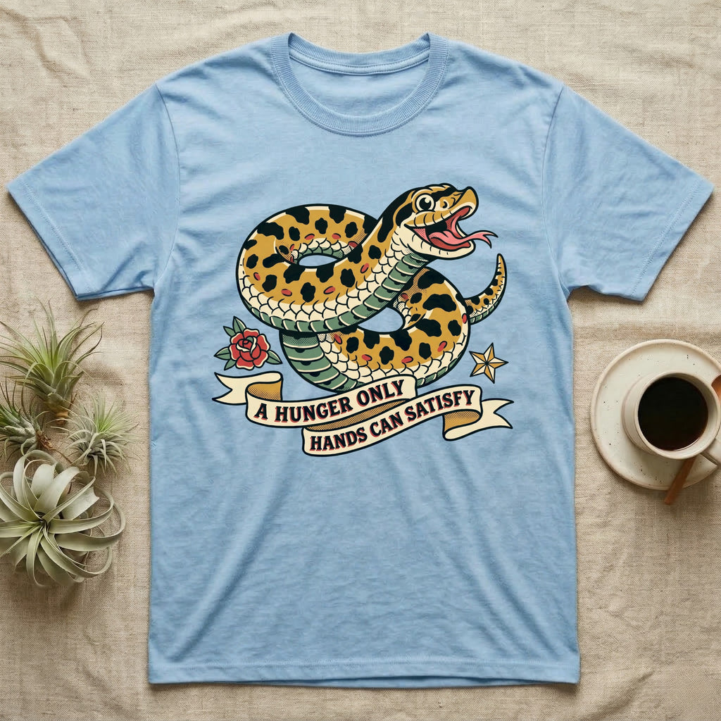 Hognose Hunger Flash T-Shirt in Light Blue — American-traditional tattoo-flash illustration of a hognose snake in a heroic coil with a banner reading the feeding-hunger line.