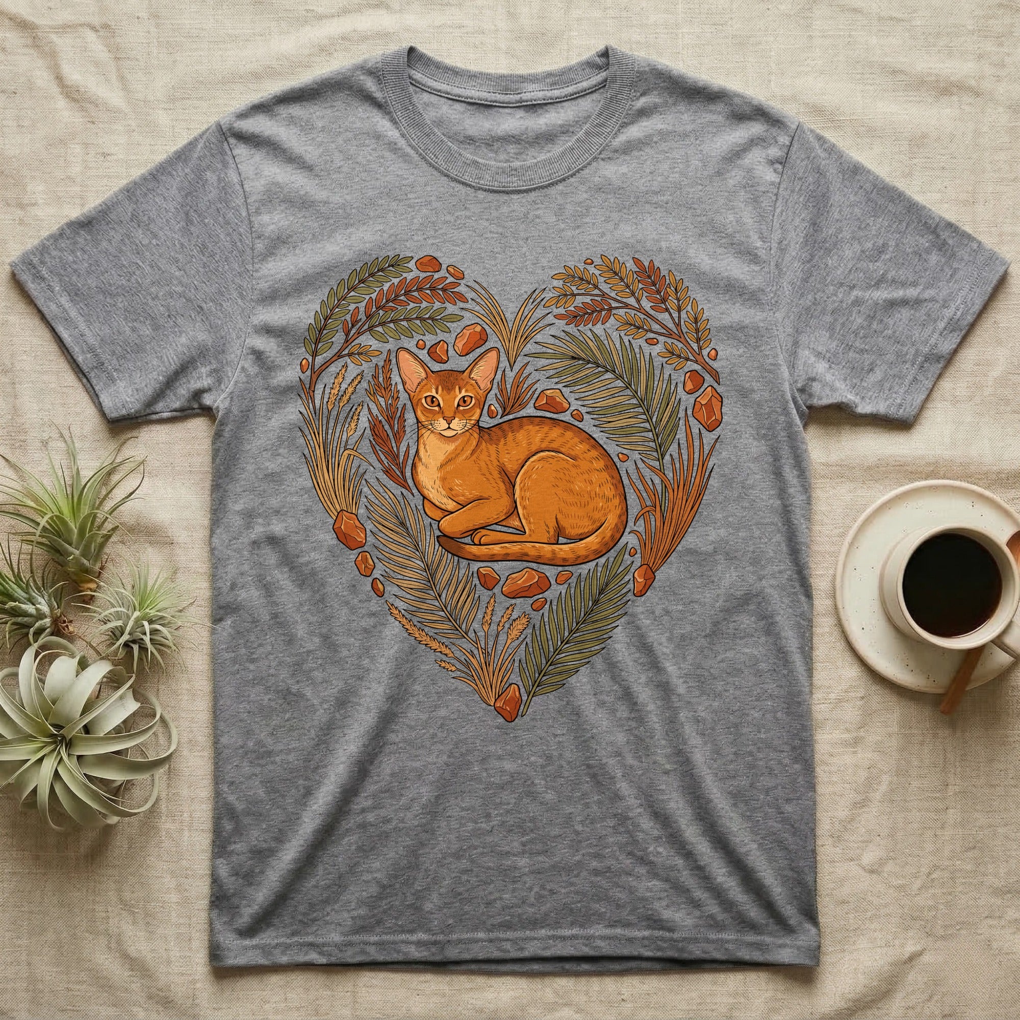 Grey t-shirt featuring a heart-shaped floral wreath with an Abyssinian cat.