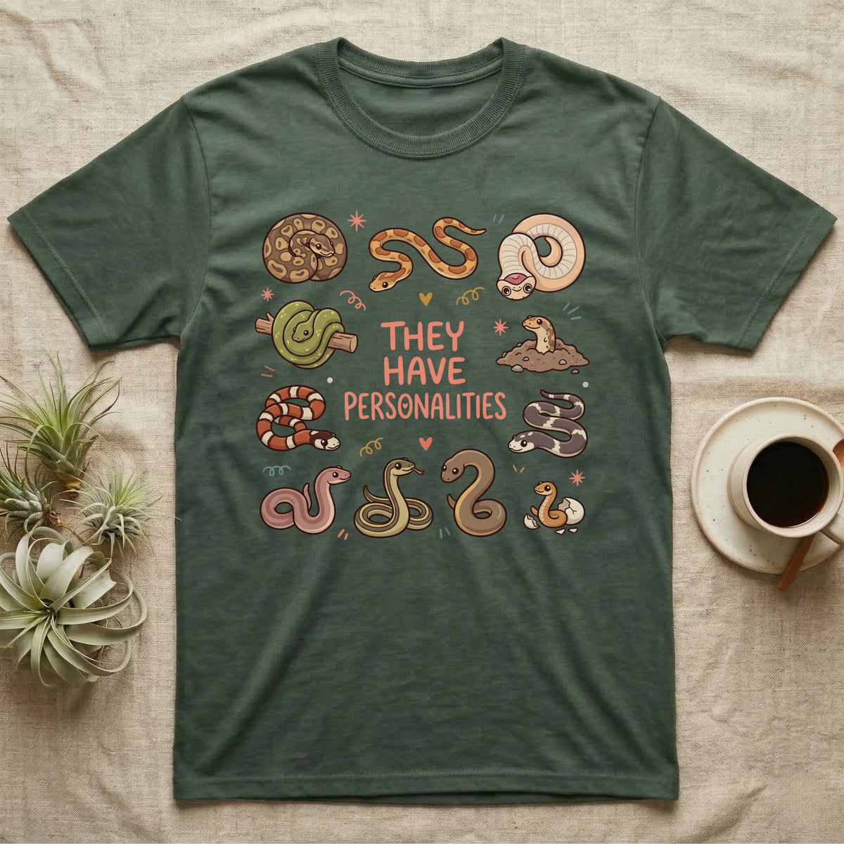 Snake Keeper Personalities T-Shirt in Military Green — Outline illustration of five snakes in different postures scattered around hand-lettered script on grey.