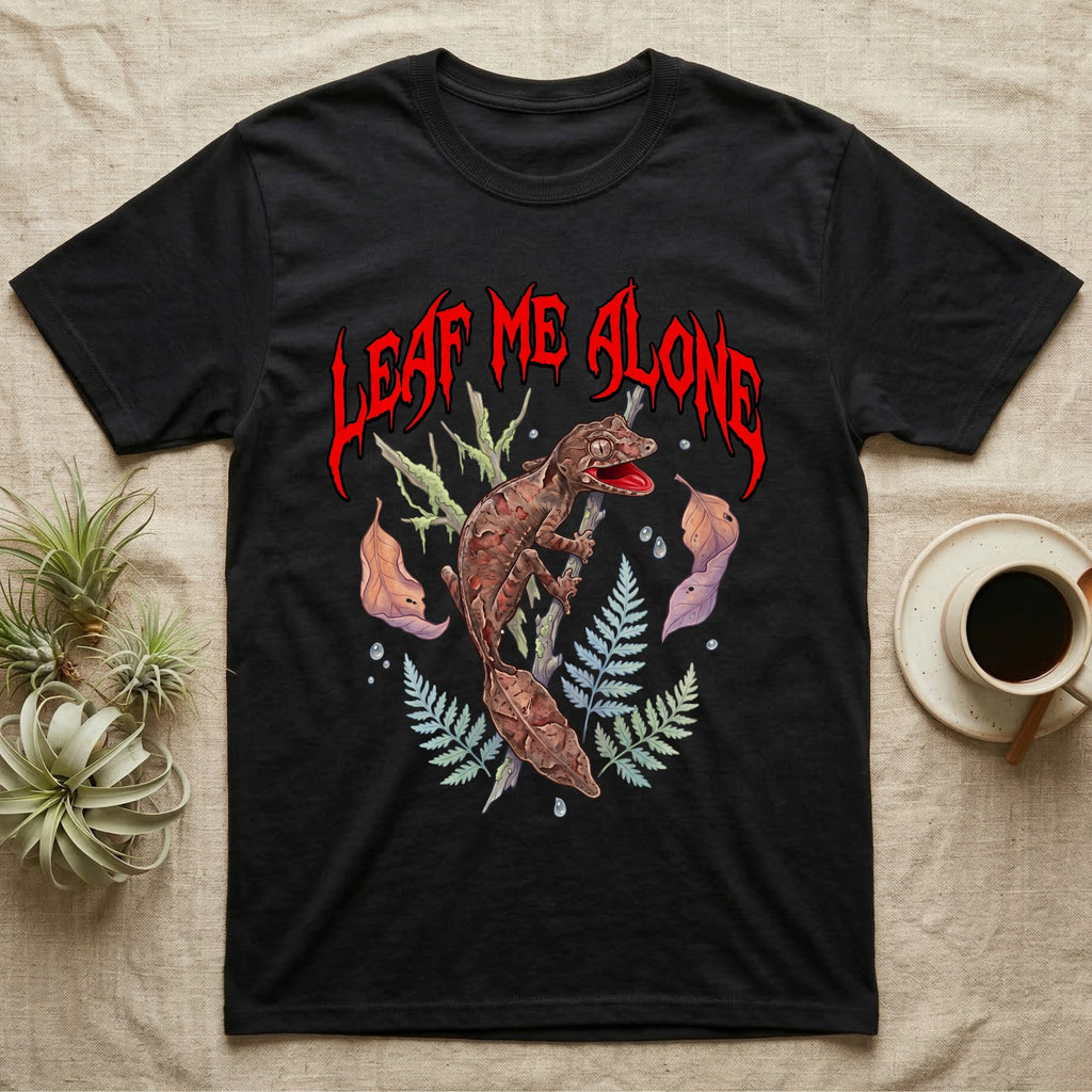 Satanic Leaf-Tailed Gecko Feral T-Shirt in Black — Satanic leaf-tailed gecko gaping on a twig with dripping blood-red metal "Leaf Me Alone" wordmark above