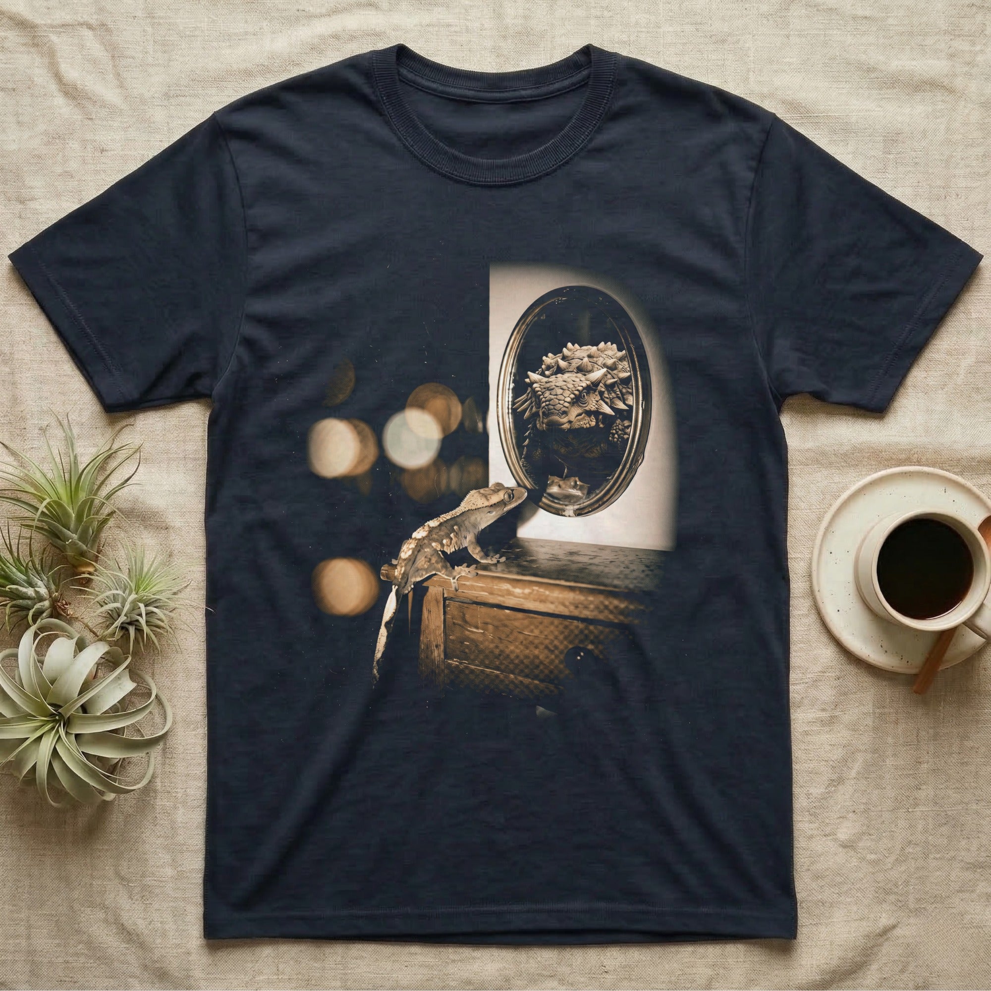Crested Gecko Dinosaur Mirror T-Shirt in Navy — Crested gecko on a nightstand looking into an oval mirror that reflects a large armoured dinosaur.