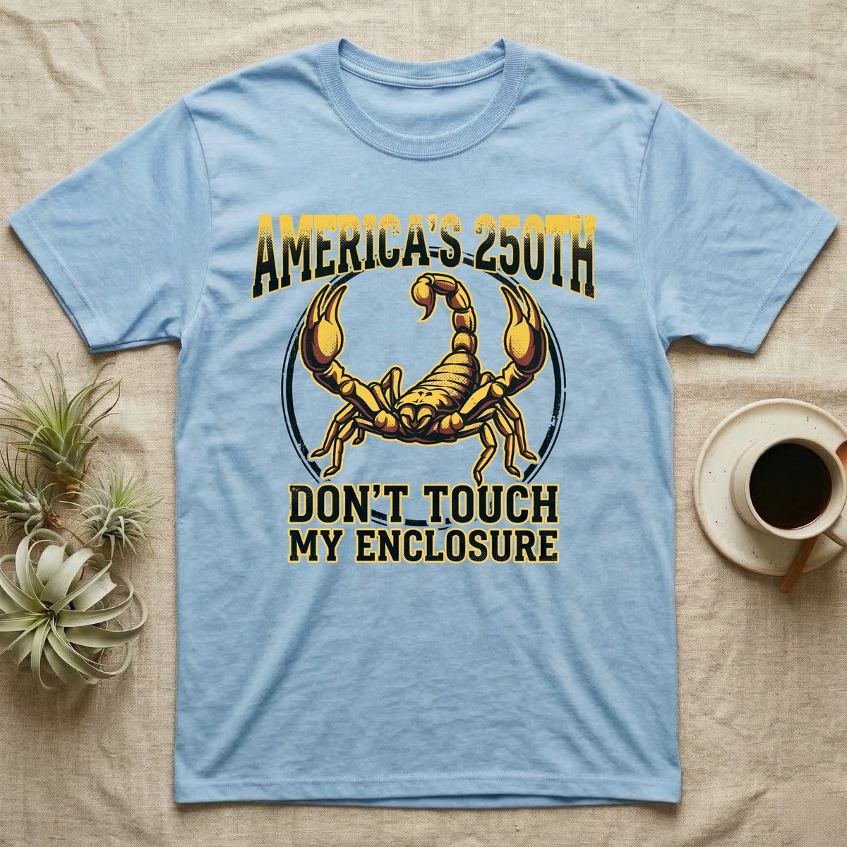 Emperor Scorpion Enclosure Tee in Light Blue — Bold gold and maroon halftone tee of an emperor scorpion with raised pincers, lettering reading AMERICA'S 250TH Don't Touch My Enclosure on black.