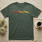 Uromastyx Colour Morph Trio T-Shirt in Military Green — Three uromastyx lizards in a row, painted in thick raised relief — brick red, tangerine orange and lemon yellow morphs.