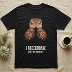 Deadpan mugshot of a rust-brown ackie monitor on black, captioned I redecorate, you'll get used to it. — shown on a Black tee.