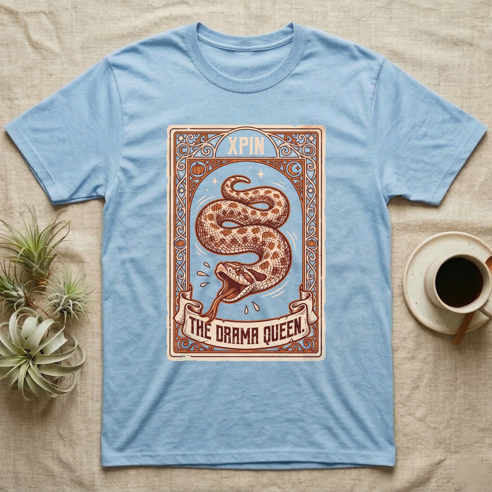 Hognose Snake Drama Queen T-Shirt in Light Blue — Ornate tarot card of a western hognose snake playing dead, banner reading "The Drama Queen."